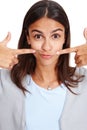 Portrait, mouth or pointing and a woman in studio isolated on a white background with a smile gesture. Face, happy and