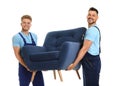 Portrait of moving service employees with armchair
