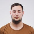 Portrait, mugshot and man in studio for arrest, political activism or human rights with white background. Activist