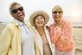 Portrait of Multi ethnic Female Friends Laughing at Beach Royalty Free Stock Photo