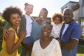 Portrait Of Multi-Generation Family Outdoors In Garden At Home Royalty Free Stock Photo