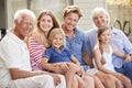 Portrait Of Multi Generation Family Relaxing On Deck At Home Royalty Free Stock Photo