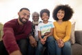 Portrait of Multi generation family smiling at home Royalty Free Stock Photo