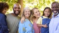 Portrait Of Multi-Generation Family Standing In Garden Smiling At Camera Royalty Free Stock Photo