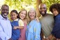 Portrait Of Multi-Generation Family Standing In Garden Smiling At Camera Royalty Free Stock Photo