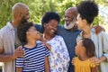 Portrait Of Multi-Generation Family Standing Outdoors In Garden Or Countryside Smiling At Camera Royalty Free Stock Photo