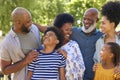 Portrait Of Multi-Generation Family Standing Outdoors In Garden Or Countryside Smiling At Camera Royalty Free Stock Photo