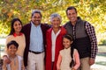 Portrait of multi-generation family standing at park Royalty Free Stock Photo