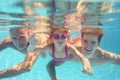 Portrait Of Multi-Generation Family On Summer Holiday Swimming Underwater In Pool Royalty Free Stock Photo