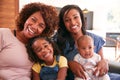 Portrait Of Multi-Generation Female African American Family Sitting On Sofa At Home Royalty Free Stock Photo