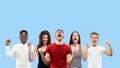 Portrait of multiethnic group of young people isolated on blue studio background, flyer, collage Royalty Free Stock Photo