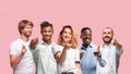 Portrait of multiethnic group of young people isolated on pink studio background, flyer, collage