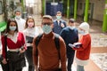 Portrait of multiethnic students group at university wearing protective face mask