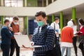 Portrait of multiethnic students group at university wearing protective face mask