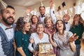 A portrait of multigeneration family with presents on a indoor birthday party. Royalty Free Stock Photo