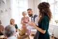 A portrait of multigeneration family with presents on a indoor birthday party. Royalty Free Stock Photo