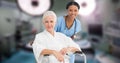 Portrait of multiracial smiling young doctor with senior woman sitting on wheelchair in hospital