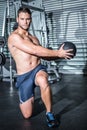 Portrait of muscular man doing exercise with medicine ball Royalty Free Stock Photo