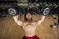 Portrait of a muscular man lifting weights at the gym Royalty Free Stock Photo