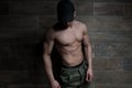 Portrait of Muscular Man Standing Near the Wall Royalty Free Stock Photo