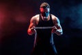 Portrait of muscular sportsman tearing metal chain. Black background with smoke Royalty Free Stock Photo