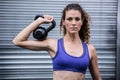 Portrait of muscular woman exercising with kettlebell Royalty Free Stock Photo