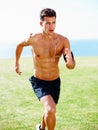 Muscular young man running against sky - Outdoor. Portrait of a muscular young man running against sky - Outdoor. Royalty Free Stock Photo