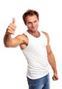 Portrait of a muscular young man, thumb up Royalty Free Stock Photo