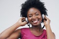 Portrait, music or happy black woman in headphones in studio for singing on grey background. Model, face or African Royalty Free Stock Photo