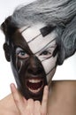 Portrait with musical makeup and rock gesture Royalty Free Stock Photo