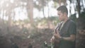 Portrait musician man with guitar at the forrest