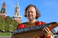 Portrait of a musician with old Russian music instrument gusli Royalty Free Stock Photo