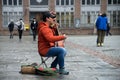 Portrait of musician playing traditional Mongolian violin in the street