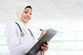 Smiling asian medical doctor in scarf