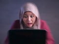 Muslim Businesswoman Working on Laptop Shocked Stunned gesture Royalty Free Stock Photo