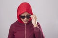 Muslim Lady in Red Peek From Her Sunglasses Royalty Free Stock Photo