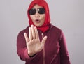 Muslim Lady in Red Shows Stop Gesture Royalty Free Stock Photo