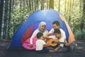 Muslim parents and children camping in the forest