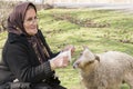 Portrait of a Muslim woman knitting woollen sock when she care s