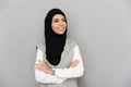 Portrait of muslim woman 20s in traditional scarf smiling and lo Royalty Free Stock Photo