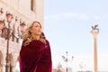 Portrait of mysterious woman in red cloak Royalty Free Stock Photo