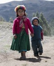 Portrait of a Native Peruvian girl and her little brother dressed in colourful traditional handmade outfit. October 21, 2012 - Pa Royalty Free Stock Photo