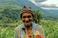 portrait a native Sinhalese Man smiling seling Organic Flowers