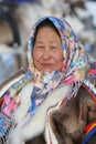 Portrait of a Nenets woman reindeer herder in national dress in Siberia