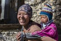 Portrait nepalese mother and child on the street in Himalayan village, Nepal