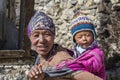 Portrait nepalese mother and child on the street in Himalayan village, Nepal