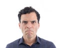 Portrait of a nervous man. The person is wearing dark blue social shirt. Isolated..