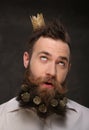 Portrait of new year man, long beard with Christmas cones