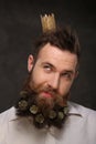 Portrait of new year man, long beard with Christmas cones