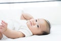 Portrait of a newborn Asian baby on the bed Royalty Free Stock Photo